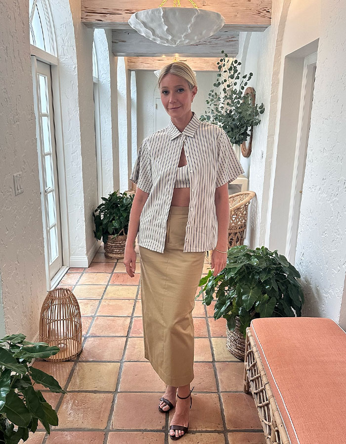Woman standing in a bright hallway with plants, illustrating Meghan Markle Montecito neighbor bombshell claims context. Woman standing in a bright hallway with plants, illustrating Meghan Markle Montecito neighbor bombshell claims context.