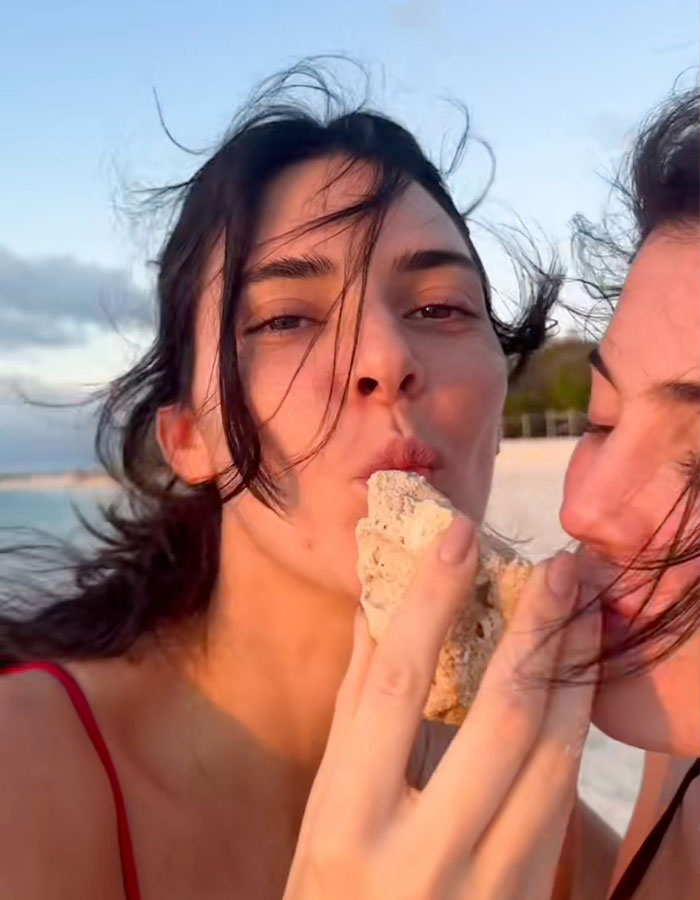 Kylie and Kendall Jenner on a beach, sharing a playful moment while enjoying a sunset walk together. Kylie and Kendall Jenner on a beach, sharing a playful moment while enjoying a sunset walk together.