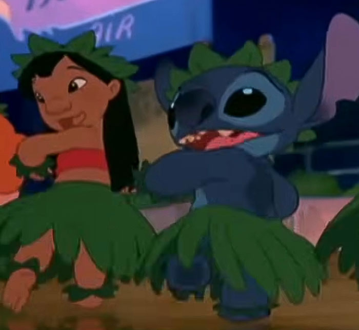 Animated scene of Lilo and Stitch dancing in grass skirts, highlighting Disney fans' reaction to character look changes. Animated scene of Lilo and Stitch dancing in grass skirts, highlighting Disney fans' reaction to character look changes.