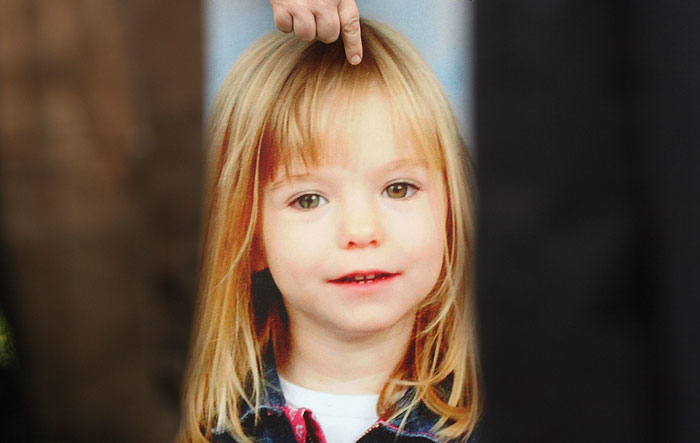 Young blonde girl with a slight smile, related to Madeleine McCann case, captured in a close-up image with soft lighting. Young blonde girl with a slight smile, related to Madeleine McCann case, captured in a close-up image with soft lighting.