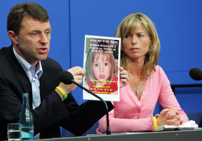 Parents of Madeleine McCann holding a photo of their missing daughter during a press conference. Parents of Madeleine McCann holding a photo of their missing daughter during a press conference.