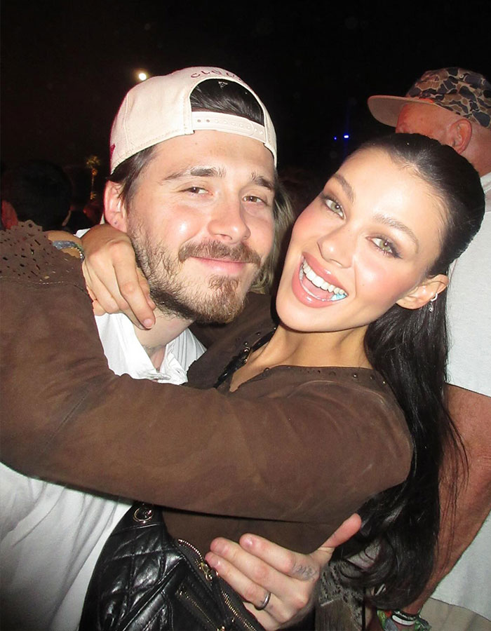 Bella Thorne smiling and hugging a man outdoors at night, related to Brooklyn Beckham wife Nicola Peltz warning story. Bella Thorne smiling and hugging a man outdoors at night, related to Brooklyn Beckham wife Nicola Peltz warning story.