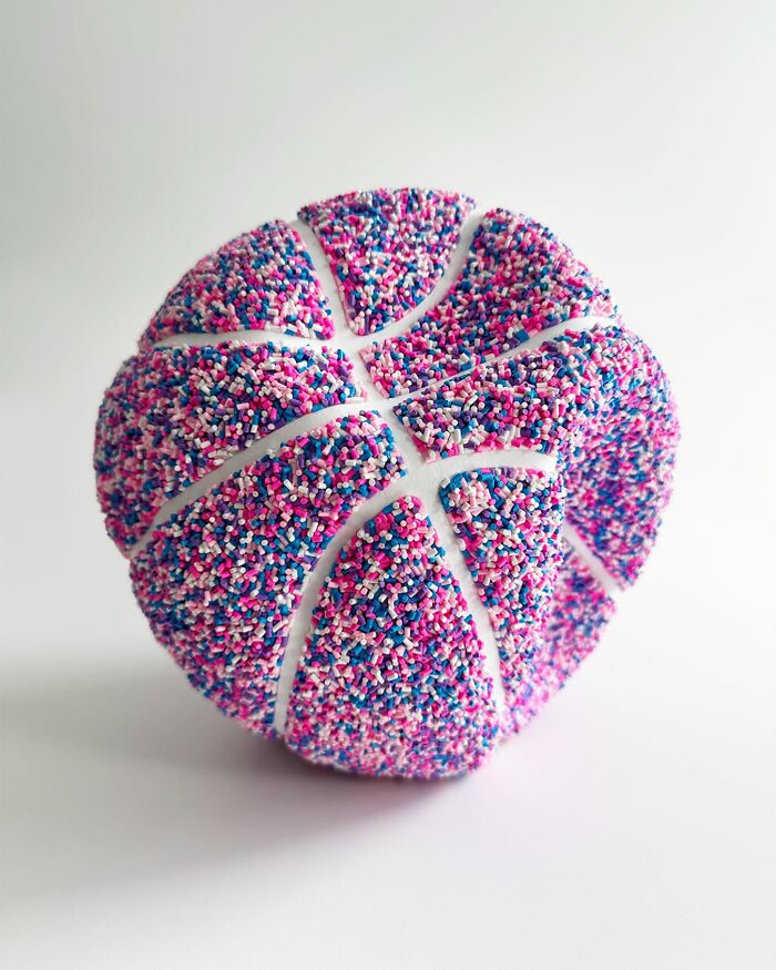 Colorful basketball covered in pink, blue, and white sprinkles creating unique art by Pepe Bratanov.