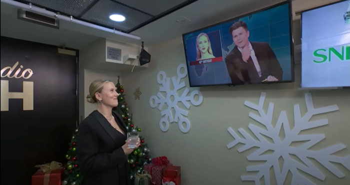 Scarlett Johansson and husband watching SNL on TV in decorated room after crude roast beef joke incident. Scarlett Johansson and husband watching SNL on TV in decorated room after crude roast beef joke incident.