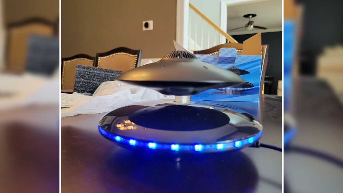 Levitating Bluetooth speaker with blue LED lights on base, showcasing cool tech bits for a digital glow-up from Amazon.