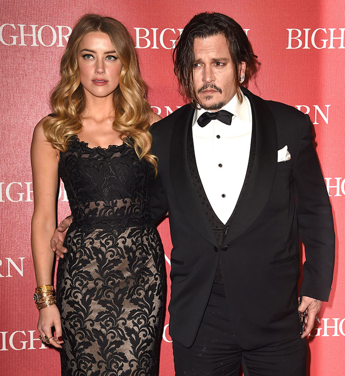 Amber Heard and Johnny Depp at a red carpet event, linked to Elon Musk embryo dispute and twins rumors. Amber Heard and Johnny Depp at a red carpet event, linked to Elon Musk embryo dispute and twins rumors.