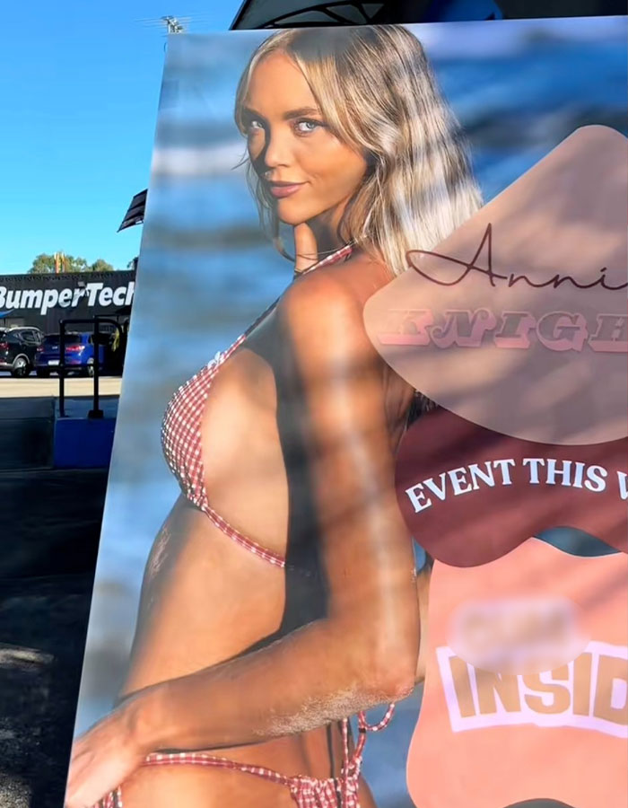 Large promotional poster of an adult content creator in a bikini, highlighting her status as an adult content creator. Large promotional poster of an adult content creator in a bikini, highlighting her status as an adult content creator.