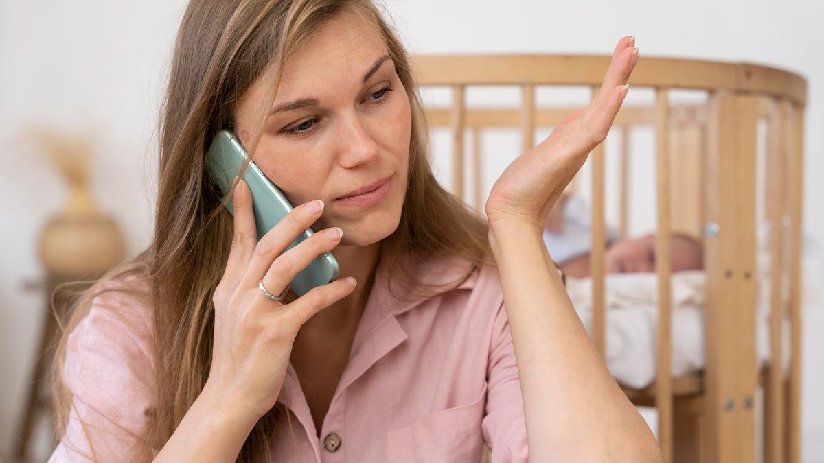Young woman talking on phone looking frustrated while caring for baby in crib, highlighting sister promises story.