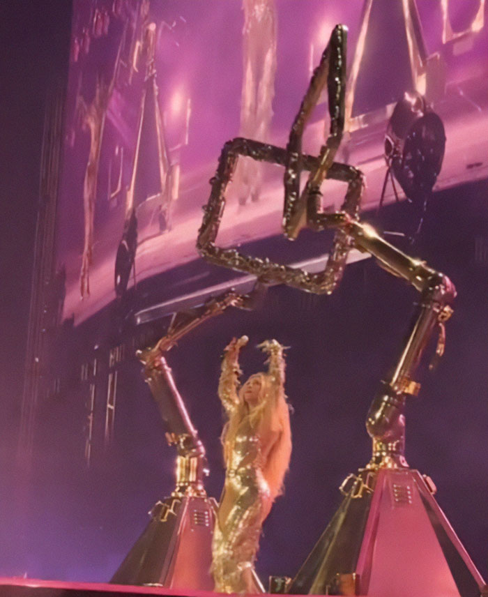 Beyoncé onstage during a show with robotic arms malfunctioning, raising serious fan safety concerns. Beyoncé onstage during a show with robotic arms malfunctioning, raising serious fan safety concerns.