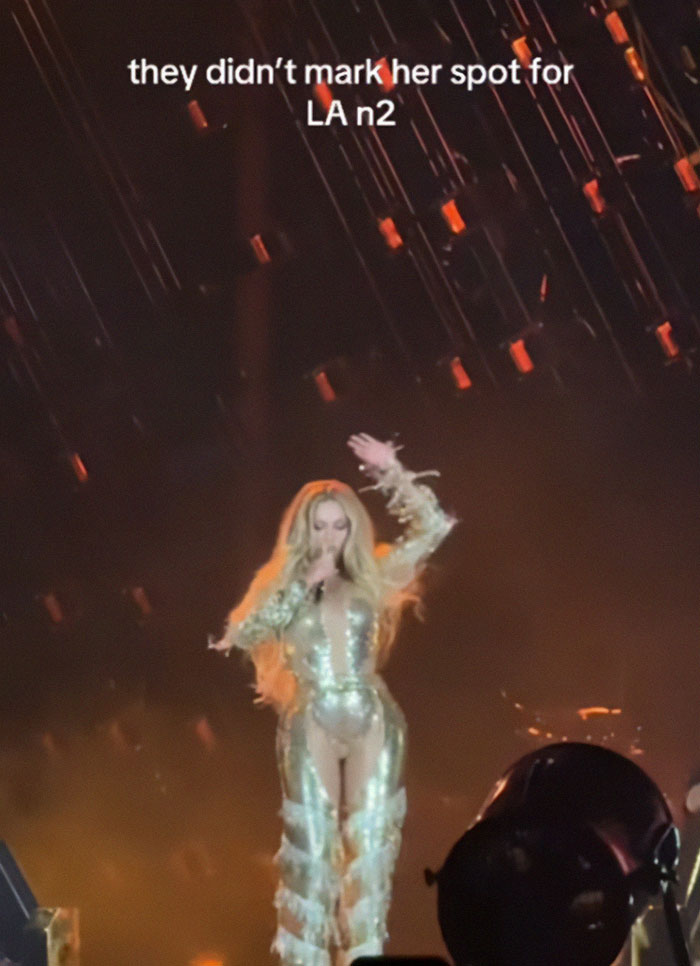 Beyoncé performing on stage in a sparkling outfit during show with fans concerned about dangerous malfunction. Beyoncé performing on stage in a sparkling outfit during show with fans concerned about dangerous malfunction.