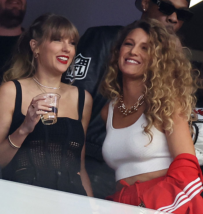 Taylor Swift and Blake Lively smiling at an event, highlighting alleged blackmail with personal texts amid feud. Taylor Swift and Blake Lively smiling at an event, highlighting alleged blackmail with personal texts amid feud.