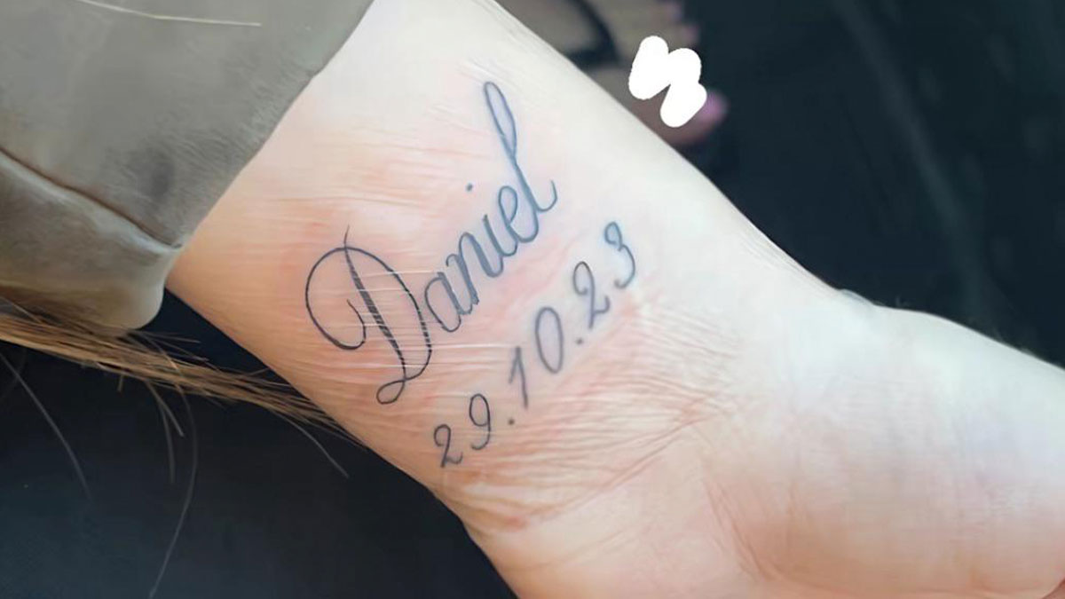 Tattoo honoring late boyfriend named Daniel with date inked on a woman's ankle, sparking relationship conflict.