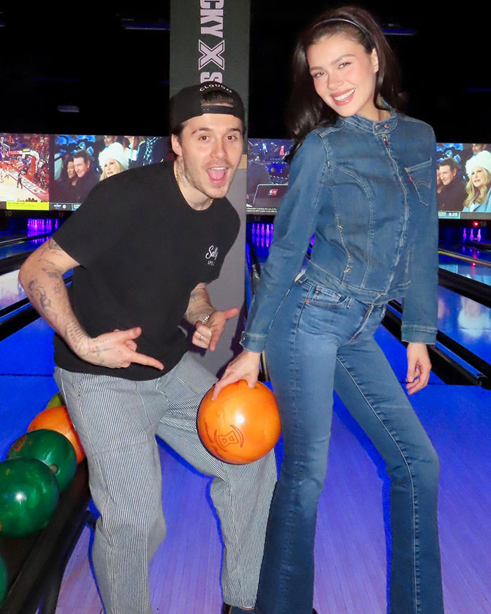 Nicola Peltz at a bowling alley with her husband Brooklyn Beckham, amid wedding rumors involving Victoria Beckham. Nicola Peltz at a bowling alley with her husband Brooklyn Beckham, amid wedding rumors involving Victoria Beckham.