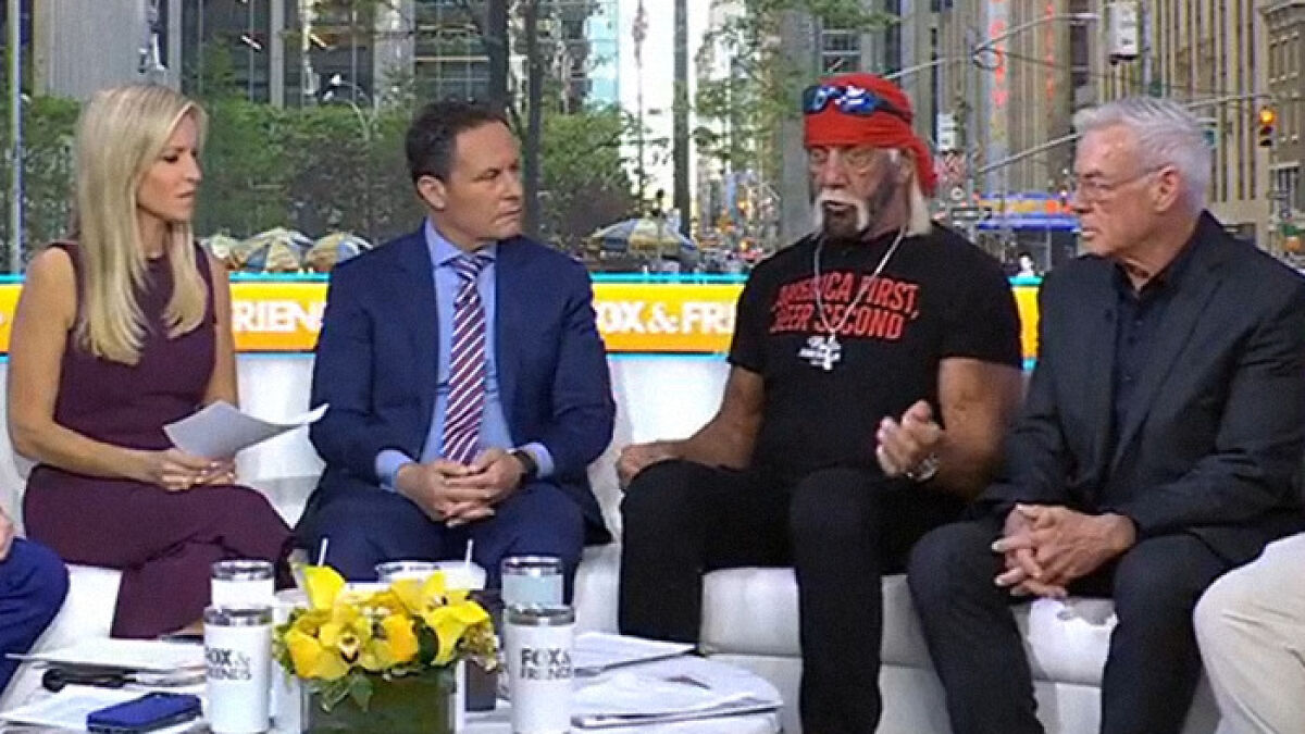 Hulk Hogan with a red bandana and black shirt appearing on a TV panel discussing his troubling new look at 71 years old.
