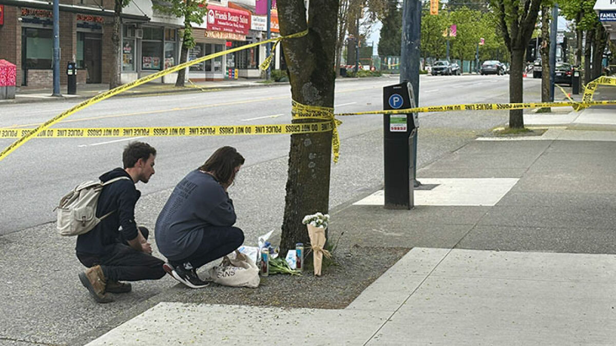 Two people crouch by a memorial near police tape at a Vancouver attack site involving Hallmark actor's family.