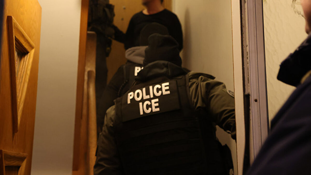 ICE agents in tactical gear enter a home during a police raid, impacting a family and their life savings.