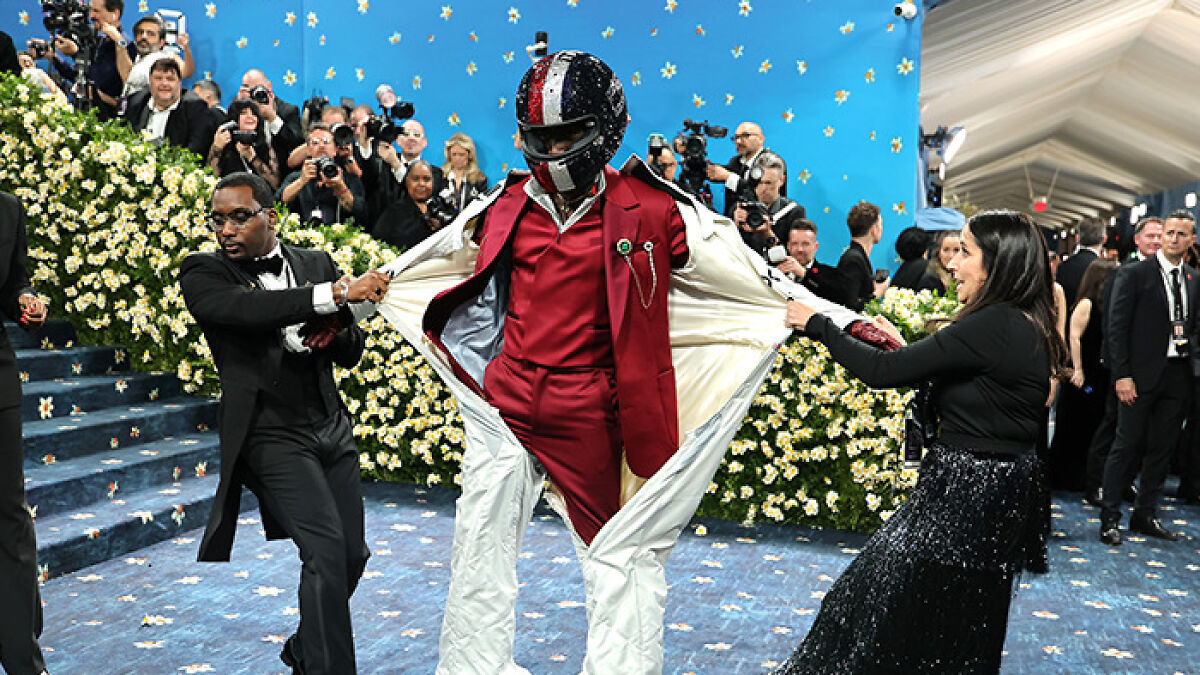 Damson Idris stuns with dramatic reveal under F1 racing suit at the Met Gala 2025, spotlighting bold fashion moment.