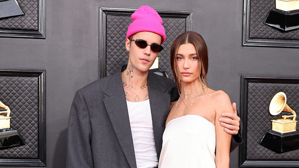 Justin Bieber with partner at event, sparking controversy over disrespecting her as his love language.