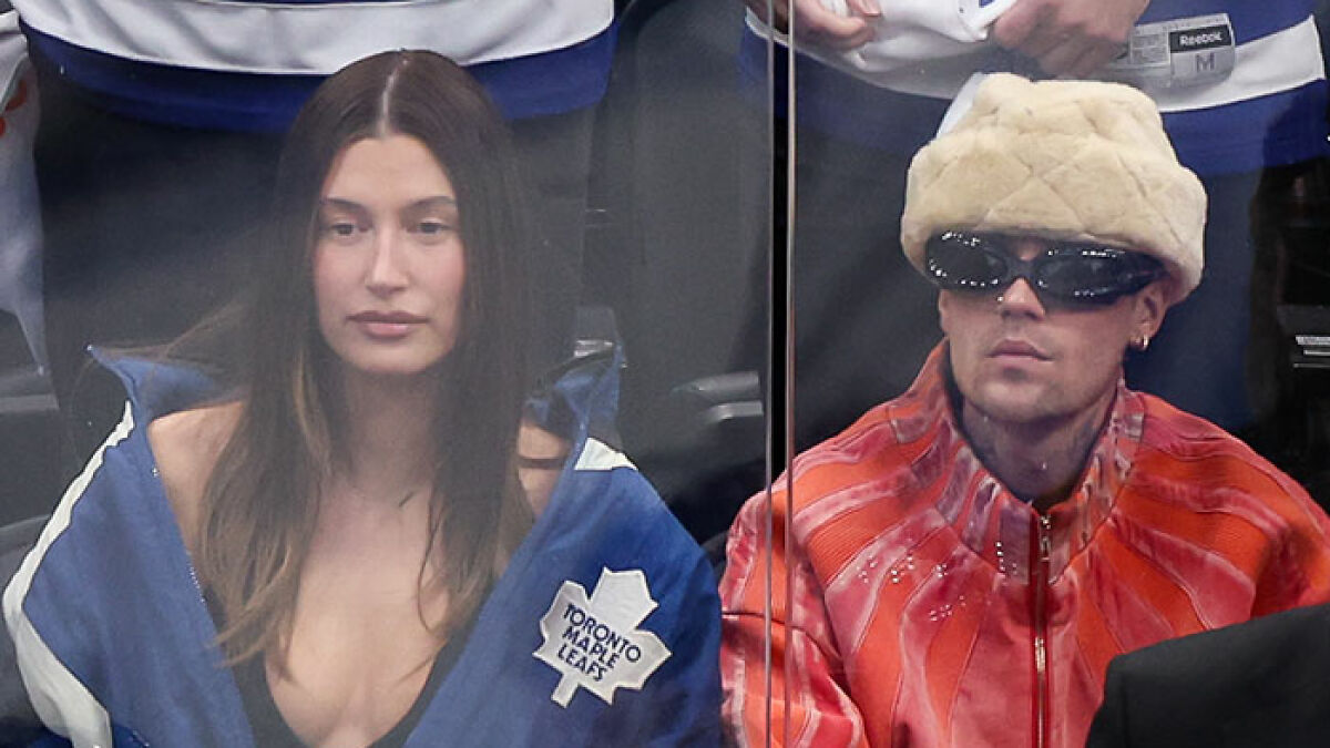 Hailey Bieber at a hockey game, wearing a Toronto Maple Leafs jacket after Justinu2019s game tantrum.