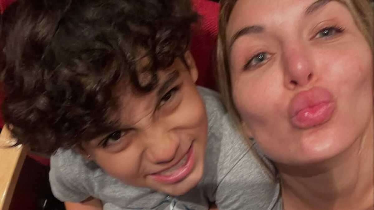 Mother and her young son smiling closely in a heartfelt moment, highlighting efforts to raise funds to freeze his body.