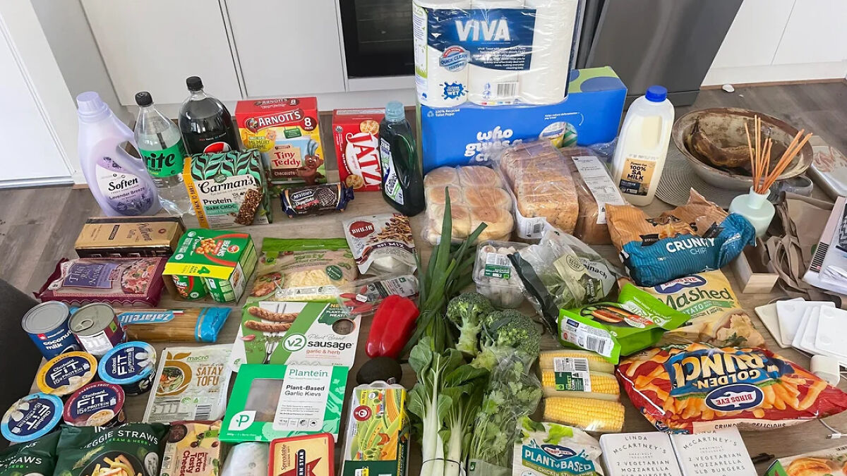 Grocery store haul with snacks, dairy, vegetables, plant-based products, and household items showing what was bought and likely spent.