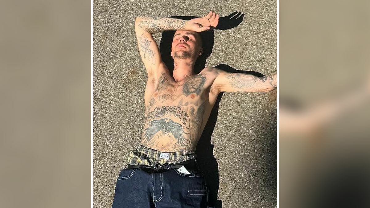 Justin Bieber shirtless outdoors showing tattoos, sparking a fiery parenting debate over smoking during holiday with son.