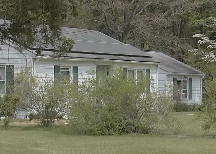 Suburban house with overgrown bushes in front, related to dad fatally beaten with metal bat incident. Suburban house with overgrown bushes in front, related to dad fatally beaten with metal bat incident.
