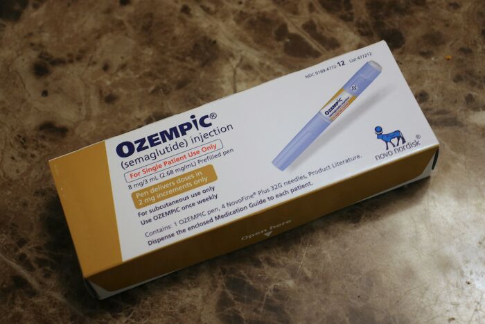 Ozempic injection pen box on a marble surface, related to Ozempic teeth side effects from weight loss medications. Ozempic injection pen box on a marble surface, related to Ozempic teeth side effects from weight loss medications.