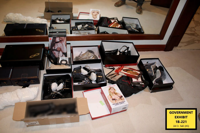 Boxes of fetish and adult items displayed on floor during Miami mansion raid in Diddy trial as government exhibit evidence. Boxes of fetish and adult items displayed on floor during Miami mansion raid in Diddy trial as government exhibit evidence.
