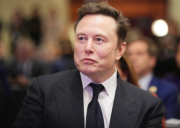 Elon Musk in a black suit and tie at a formal event, related to his trans daughter Vivian's modeling debut buzz. Elon Musk in a black suit and tie at a formal event, related to his trans daughter Vivian's modeling debut buzz.
