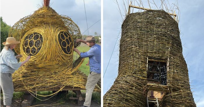 Two people weaving a large wicker structure in preparation for the Wicker Man burning event this weekend.