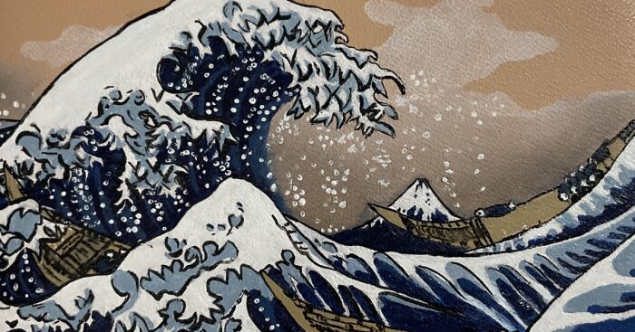 Detailed art painting of a large ocean wave with boats and a snow-covered mountain in the background.