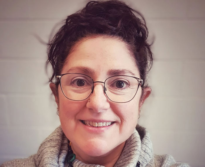 University professor with glasses and curly hair sparking fiery debate on women committing domestic violence as much as men University professor with glasses and curly hair sparking fiery debate on women committing domestic violence as much as men