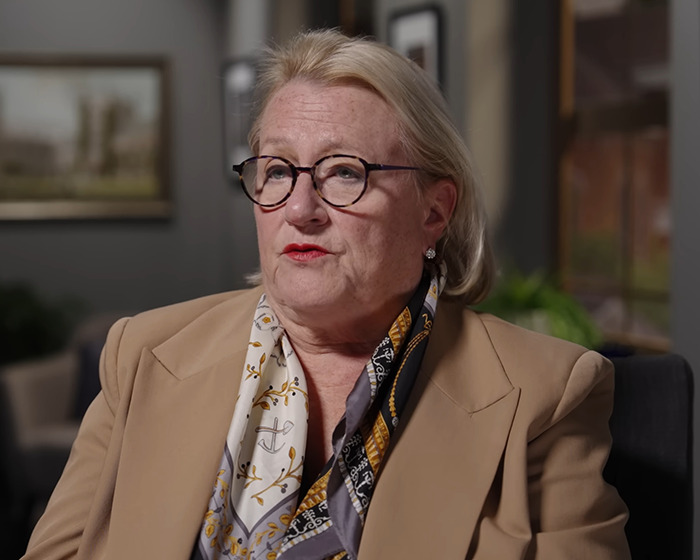 Former official with glasses and beige blazer discussing US secretly built $21 trillion underground city claims. Former official with glasses and beige blazer discussing US secretly built $21 trillion underground city claims.