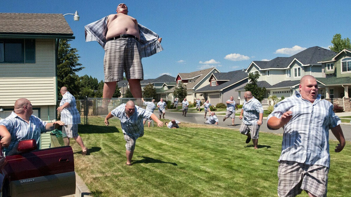 Multiple identical men running and jumping in a suburban yard, showcasing hilarious Photoshop skills in a bright neighborhood.