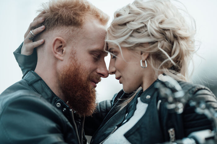A man and woman with leather jackets close together, highlighting men who lost amazing partners and share their experiences.