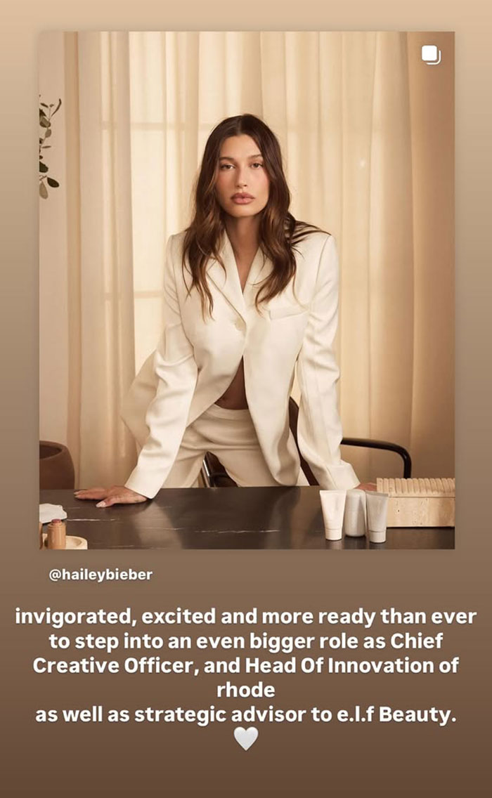Hailey Bieber in a cream suit posing confidently at a desk, related to Justin Bieber grabbing wife Hailey’s breasts news. Hailey Bieber in a cream suit posing confidently at a desk, related to Justin Bieber grabbing wife Hailey’s breasts news.