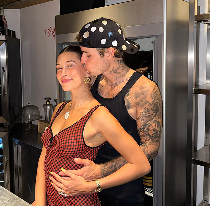Justin Bieber showing affection in a kitchen setting amid rumors and ongoing trial discussions. Justin Bieber showing affection in a kitchen setting amid rumors and ongoing trial discussions.
