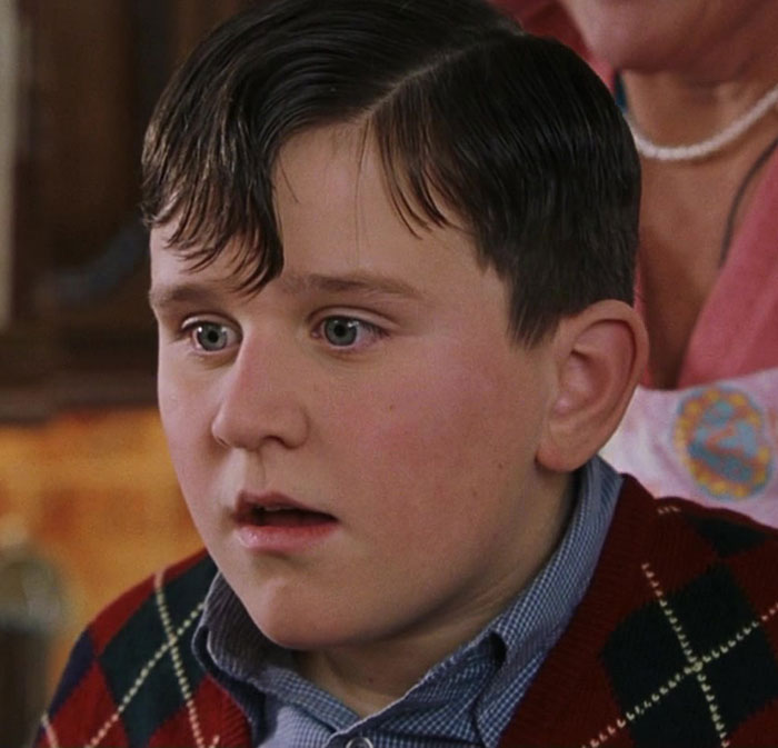 Young actor from Harry Potter series with a stunned expression, related to a controversial gay film earning standing ovation. Young actor from Harry Potter series with a stunned expression, related to a controversial gay film earning standing ovation.