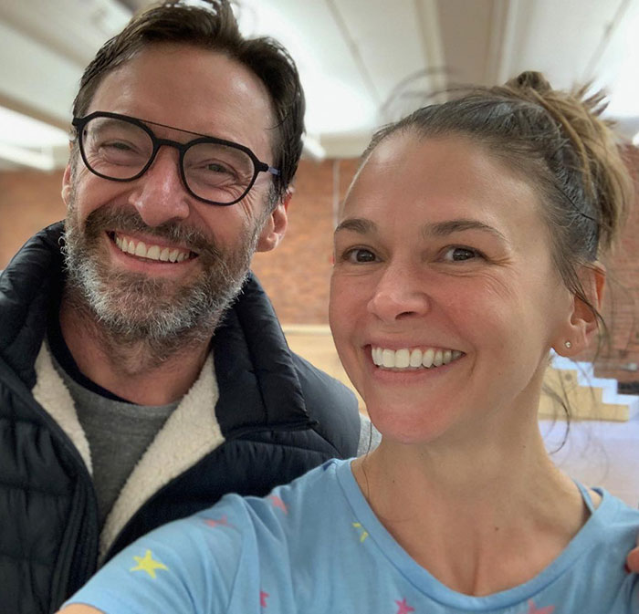 Deborra-Lee Furness and Hugh Jackman smiling together in a casual setting amid news of divorce and journey of betrayal. Deborra-Lee Furness and Hugh Jackman smiling together in a casual setting amid news of divorce and journey of betrayal.