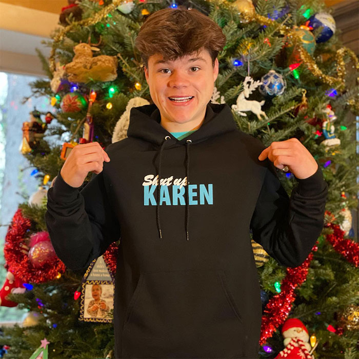 Jack Doherty standing in front of a decorated Christmas tree, representing Jack Doherty and his rising net worth.