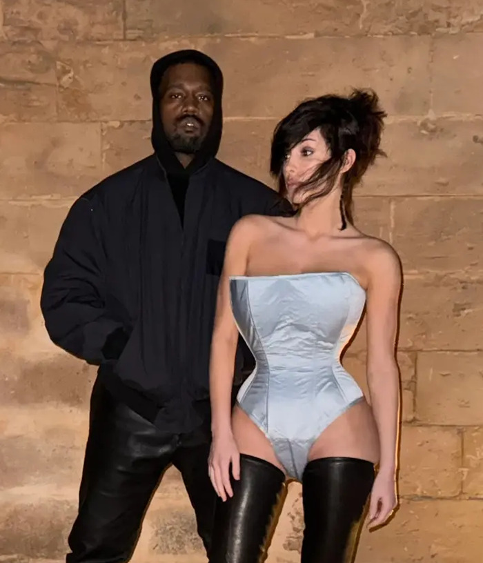 Kanye West and Bianca Censori posing together, highlighting Kanye West's post about being subservient to Bianca Censori Kanye West and Bianca Censori posing together, highlighting Kanye West's post about being subservient to Bianca Censori
