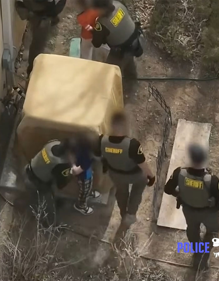 Police officers detain children in Minecraft and Star Wars pajamas after they refuse to drop a weapon during the incident. Police officers detain children in Minecraft and Star Wars pajamas after they refuse to drop a weapon during the incident.