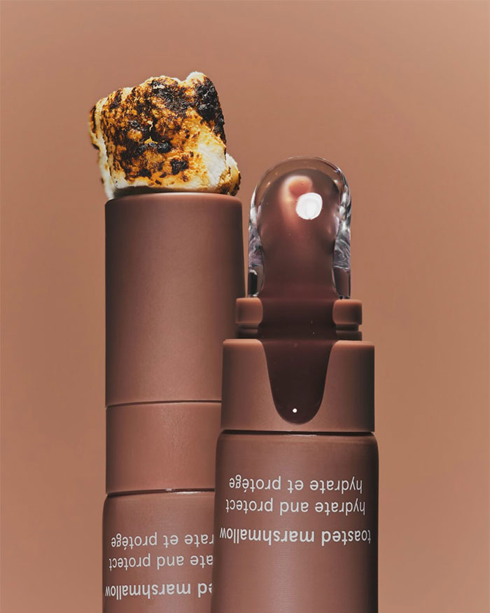 Toasted marshmallow flavored lip balm stick and tube, highlighting Kylie Jenner’s net worth and luxury lifestyle keywords.