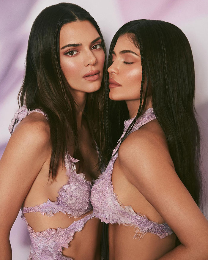 Kylie Jenner and Kendall Jenner posing in matching lavender outfits highlighting Kylie Jenner’s net worth update.