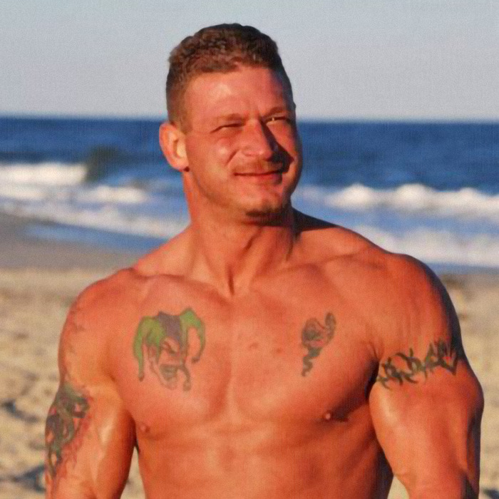 Muscular man with tattoos at the beach, relating to dad fatally beaten with metal bat news story. Muscular man with tattoos at the beach, relating to dad fatally beaten with metal bat news story.