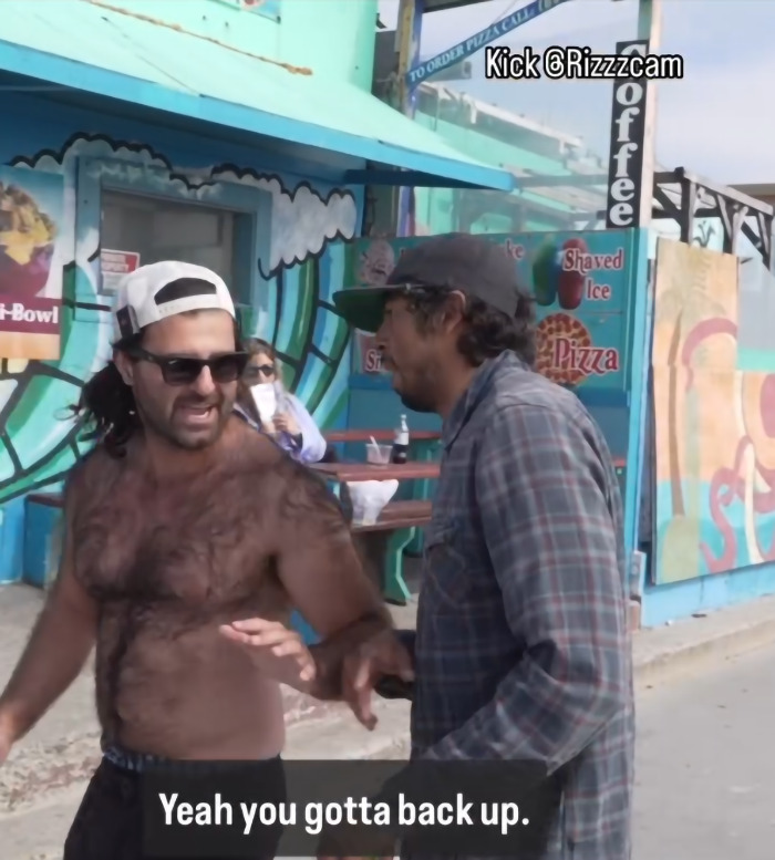 Man confronts creepy influencer filming woman with smart glasses during street interaction near colorful mural. Man confronts creepy influencer filming woman with smart glasses during street interaction near colorful mural.