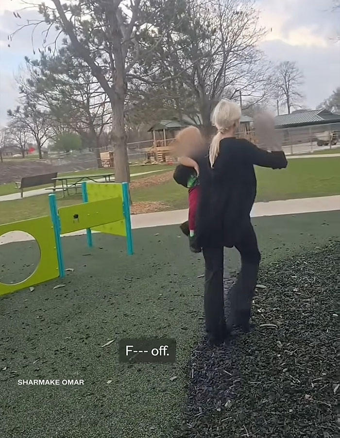 Woman carrying a child in a playground, involved in a racist incident raising controversy and funds online. Woman carrying a child in a playground, involved in a racist incident raising controversy and funds online.