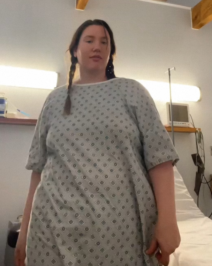 Mom wakes from surgery in hospital gown, looking surprised and unprepared for how many kids she gave birth to. Mom wakes from surgery in hospital gown, looking surprised and unprepared for how many kids she gave birth to.