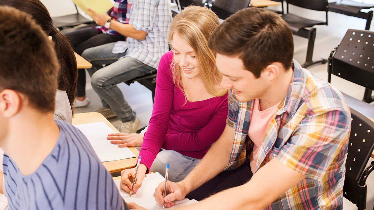 Students in a classroom collaborating on notes, highlighting real-life stories where instinct plays an important role.